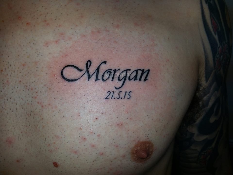name on chest tattoo
